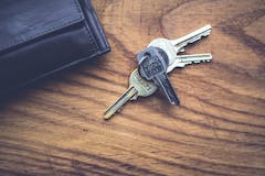 Keys on wooden table tenant screening